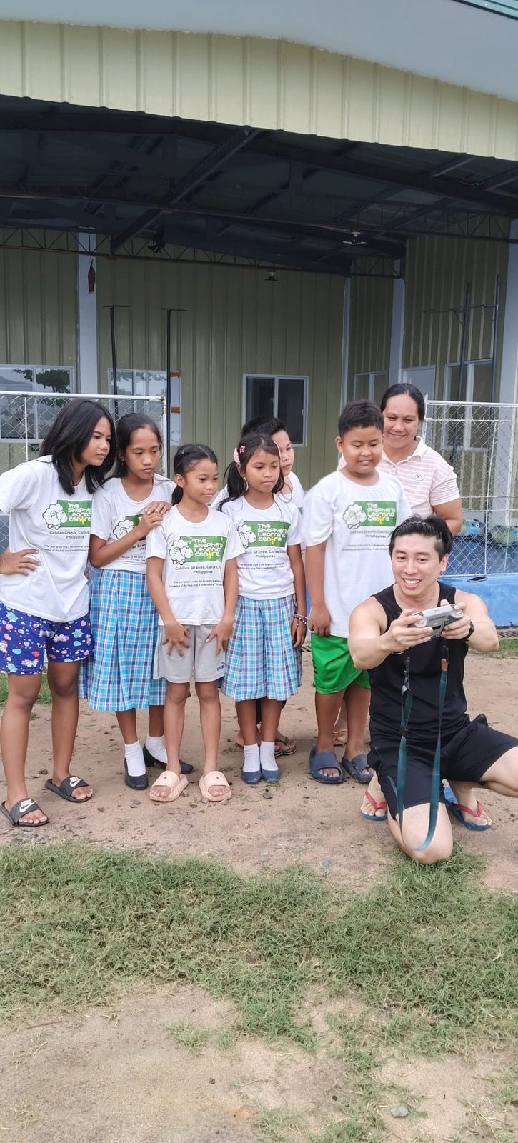 Glen Jiang with children from the orphanage, all in matching shirts