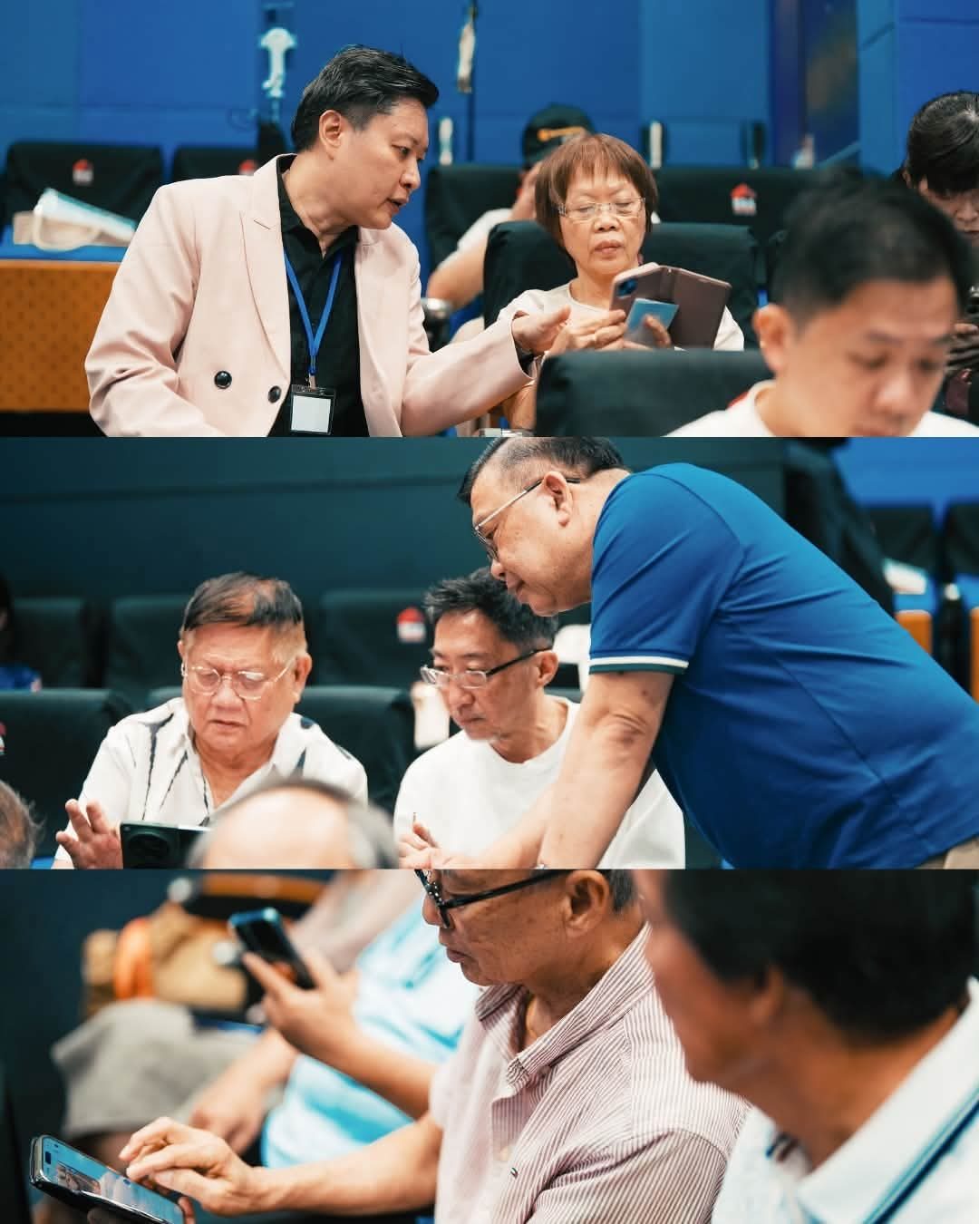 Trainers coaching learners one-to-one on their phones during a hands-on session